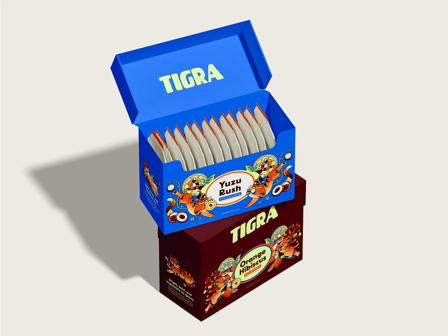 Otevřená modrá krabička TIGRA Yuzu Rush s čajovými sáčky a vínová krabička Orange Hibiscus